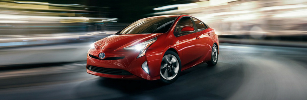 2018 Toyota Prius driving on a road.