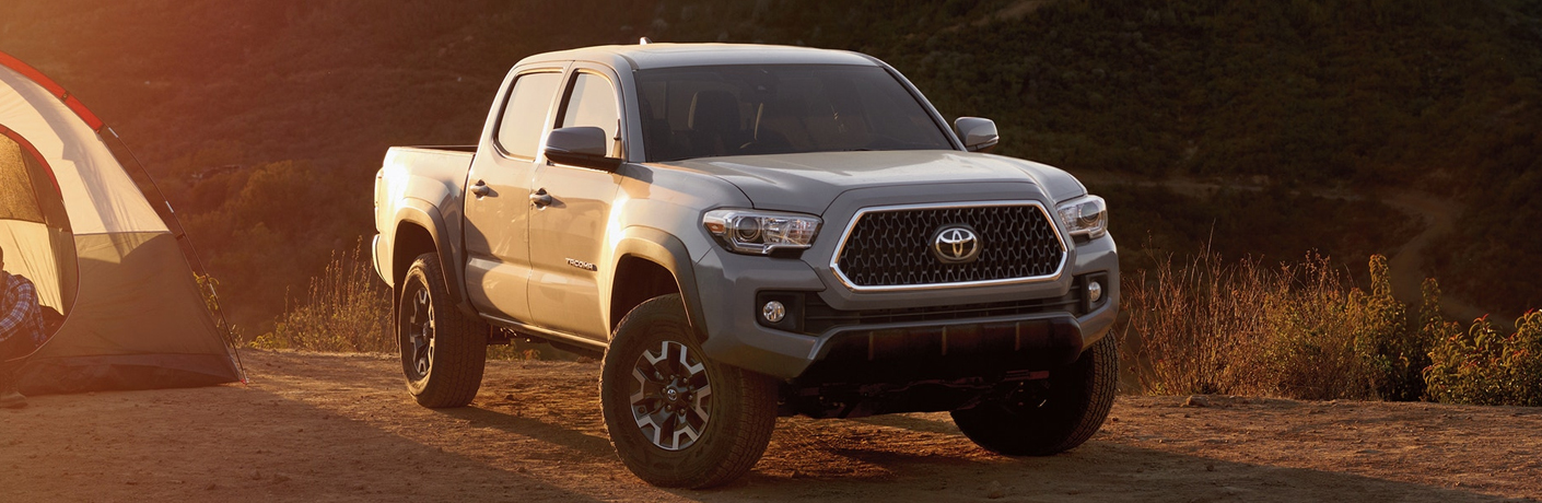 silver 2019 Toyota Tacoma driving on road