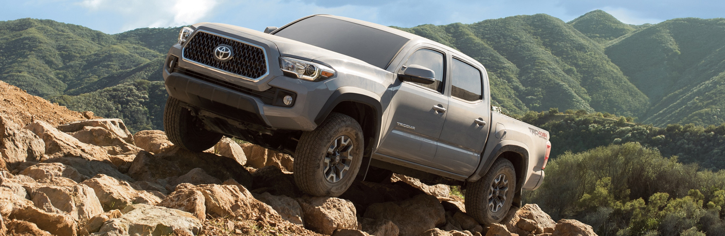 silver 2019 Toyota Tacoma on rocks