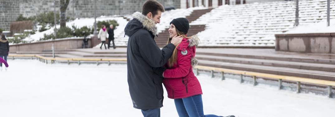 a couple looking into each others eyes on the ice