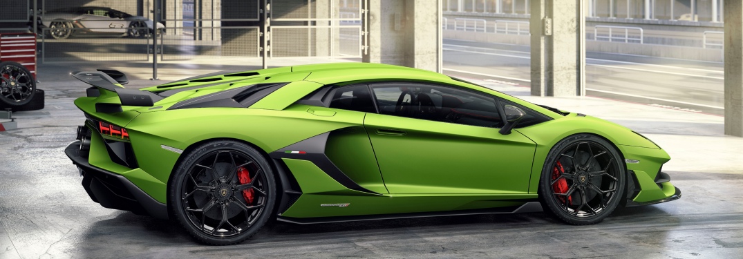 Lamborghini Aventador SVJ green side view in a garage