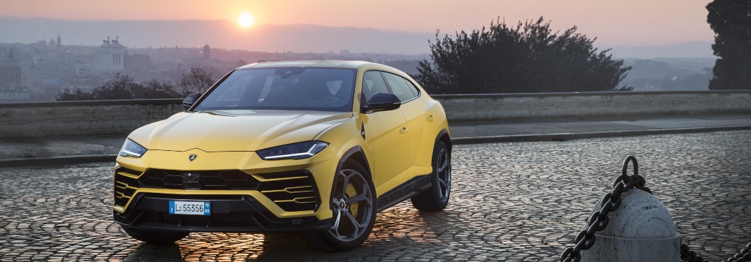 Lamborghini Urus yellow front view at sunrise