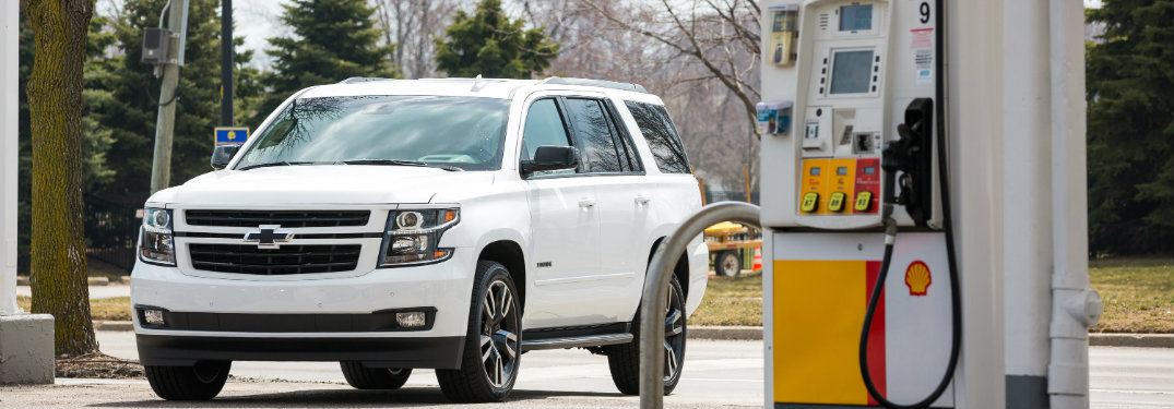2018 Chevy Tahoe parked by a Shell gas pump
