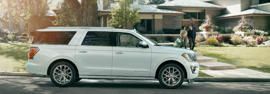 side view of a white 2018 Ford Expedition in front of a house