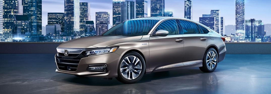 2018 Honda Accord parked in front of city skyline