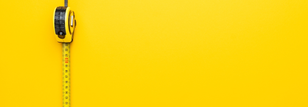 measuring tape on yellow background