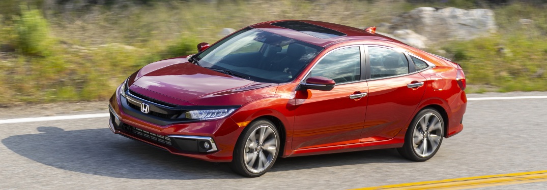 2021 Civic driving on a verdant road