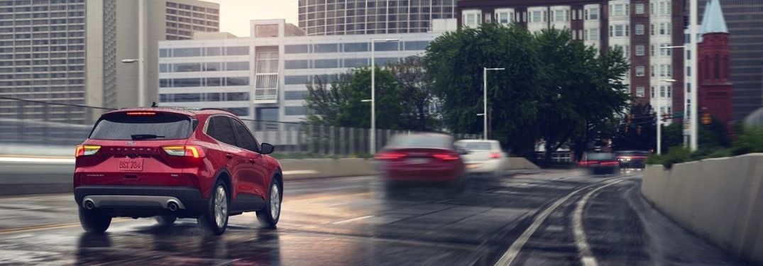 2020 Ford Escape driving on the road rear view