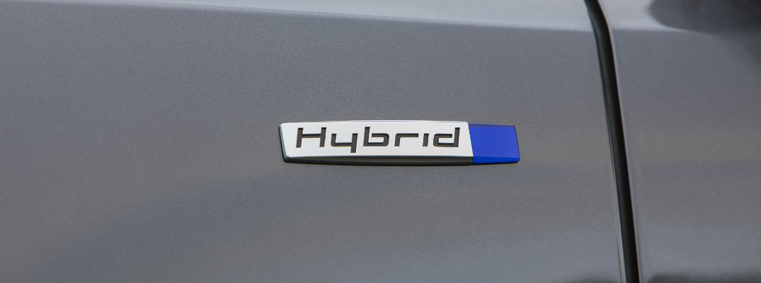 A close up photo of a hybrid badge on the 2018 Acura MDX Sport Hybrid