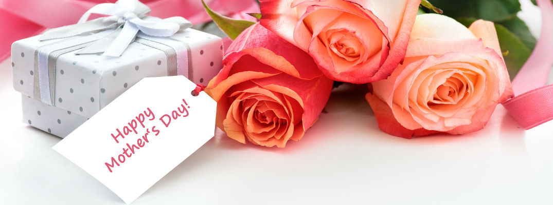 A stock photo of a table with a Mother's Day-themed table setting