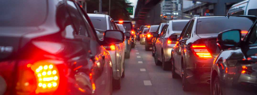 A stock photo of a line of vehicles on the road.