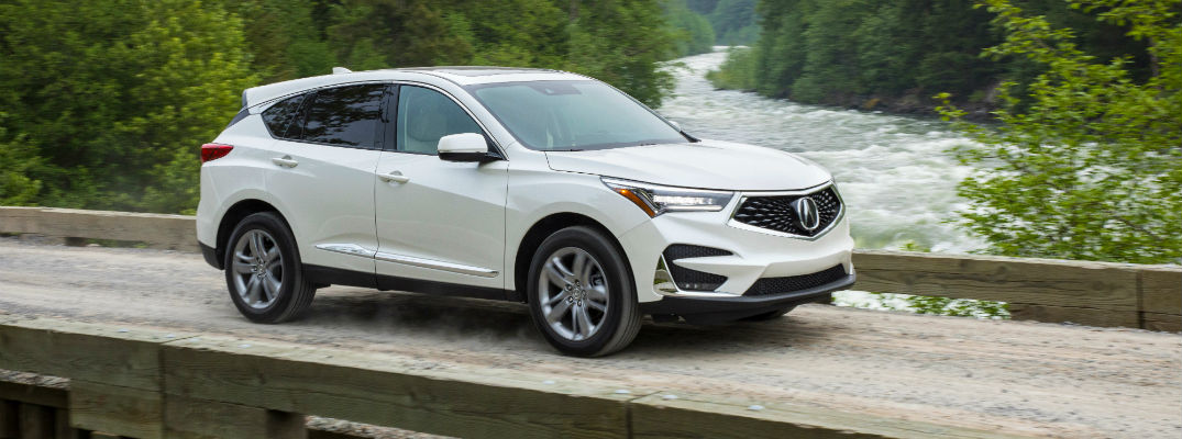 A right profile photo of the 2019 Acura RDX crossing a bridge.