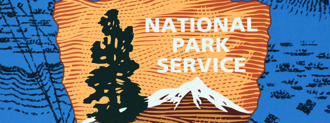 Close up of the National Park Symbol with a tree and an arrowhead