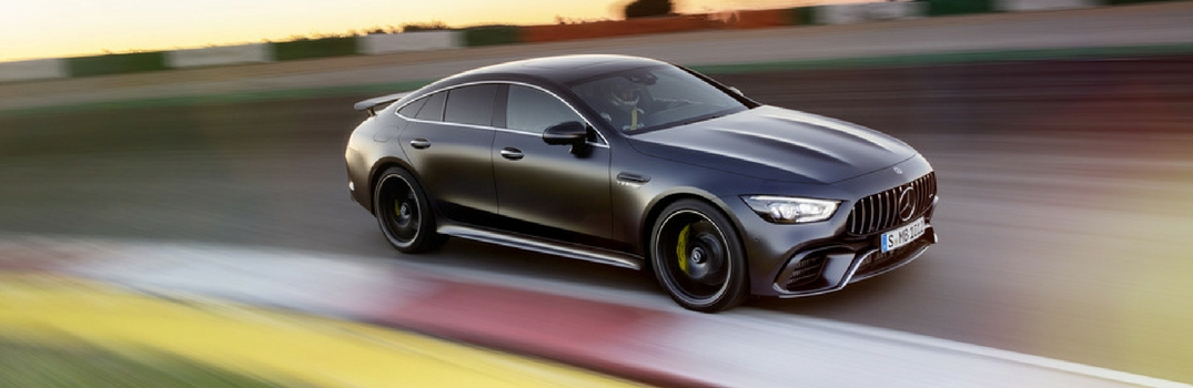 Mercedes-AMG GT 4-Door Coupe speeding down road