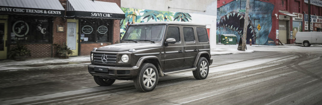2019 AMG G-Class SUV driving through a town