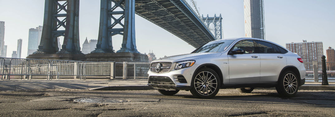 Driver side view of a gray 2018 AMG GLC43 Coupe