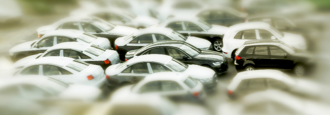 a bunch of cars in a lot