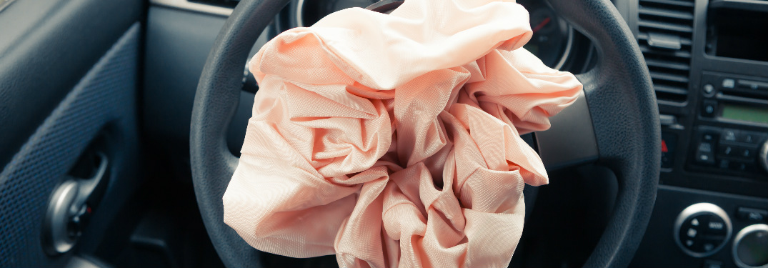 An airbag after is has deployed from a steering wheel