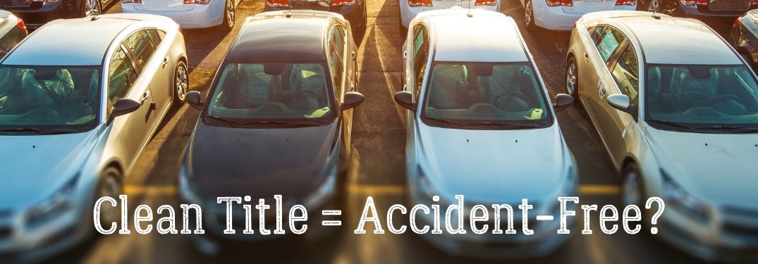 Clean Title = Accident-Free? text with rows of cars in background