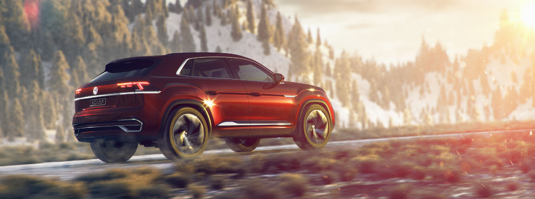 A right profile photo of the Volkswagen Atlas Cross concept vehicle on a mountain road.