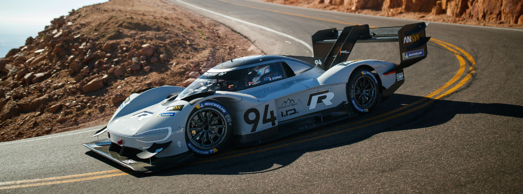 A photo of the VW ID R Pikes Peak car making a turn on the track.