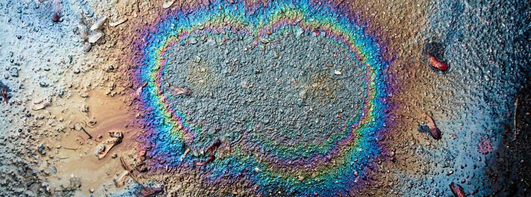 A stock photo of an oil/gas spot on the ground.