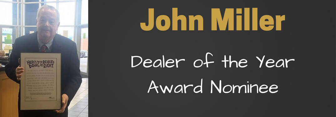john miller holding poster for dealer of the year nomination