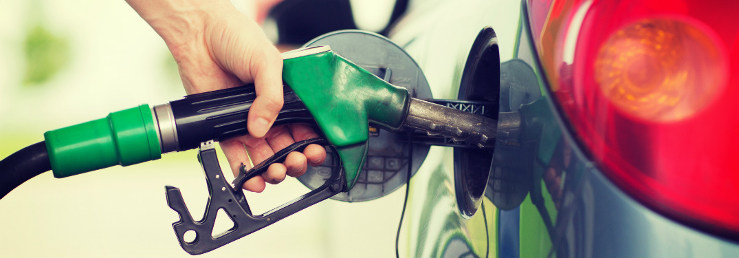 Person filling up their car with gas