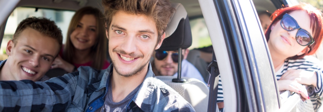 Group of friends riding in a car