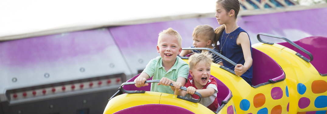 Kids riding on a rollercoaster