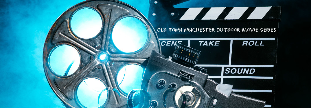 Film reel and marker on blue background