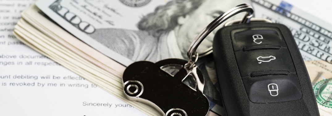 car keys and cash on top of contract
