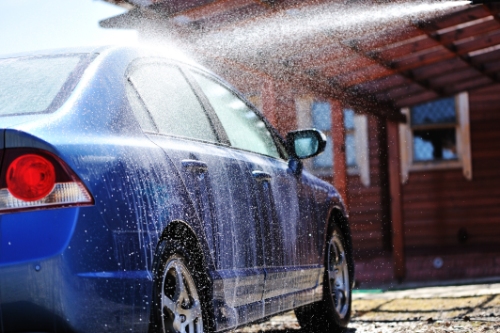 Blue car being washed off