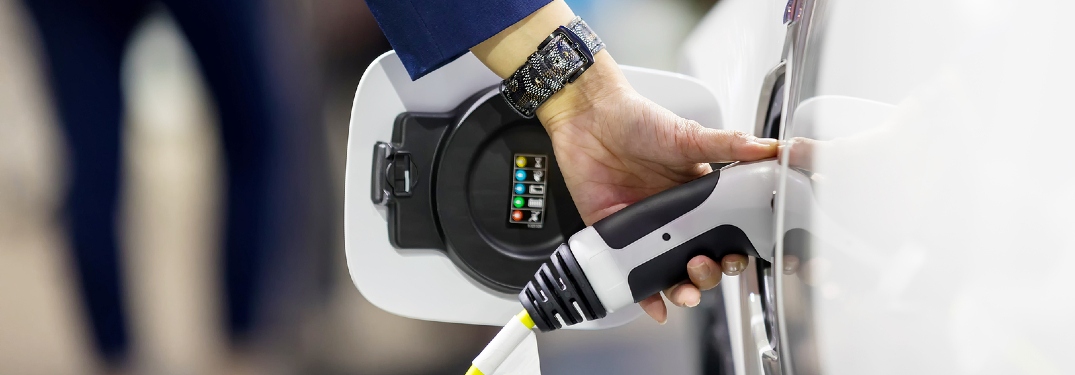 person charging EV