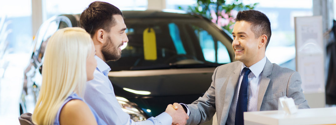 Customer and salesperson shaking hands