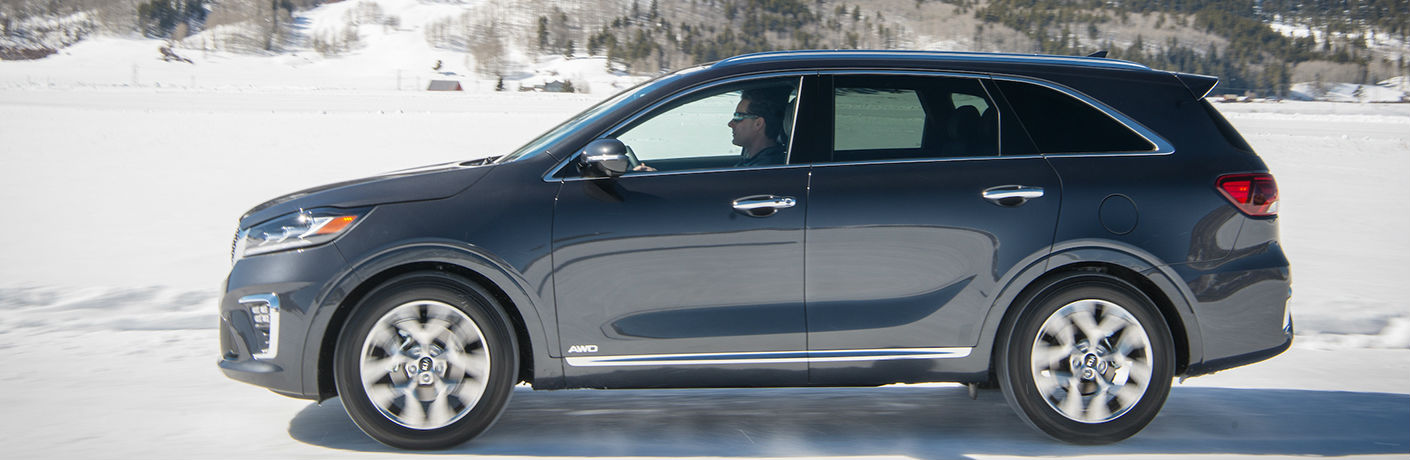 2019 Kia Sorento exterior drivers side profile with man driving