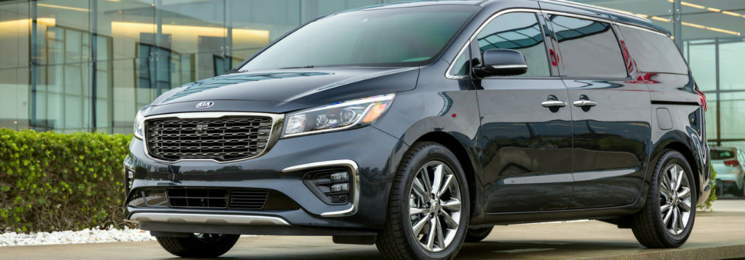 2019 Kia Soul exterior front fascai and drivers side in front of glass window building