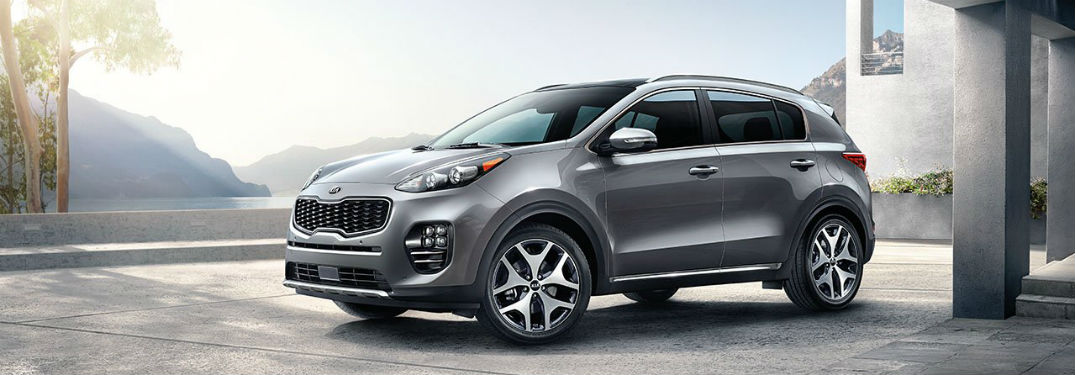 2019 Kia Sportage exterior front fascia and drivers side on stone patio cement pillars