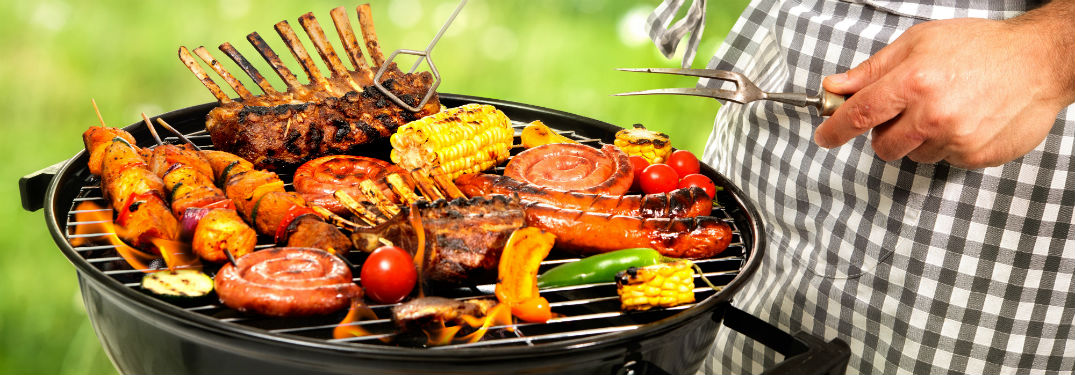 man grilling kebabs meat and veggies