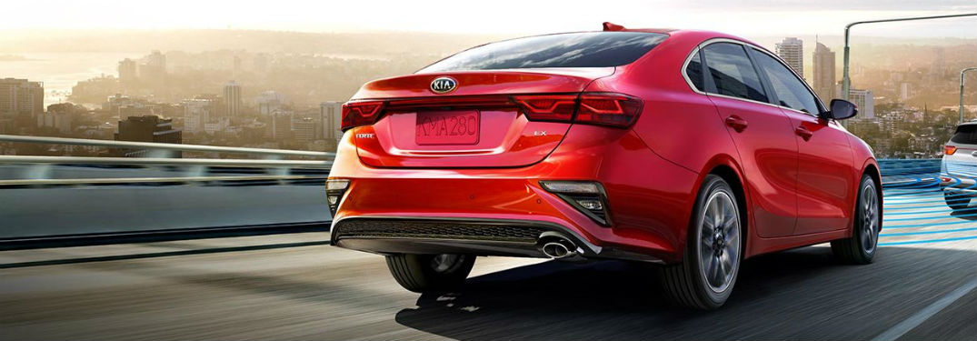 2019 Kia Forte exterior back fascia and passenger side going fast on city highway