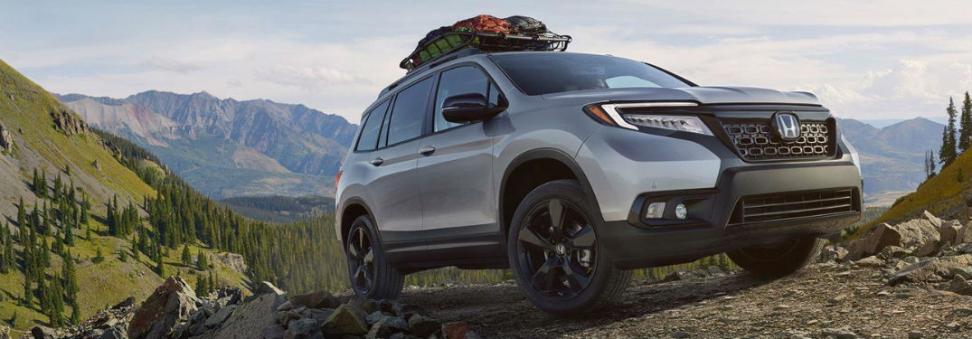 2019 Honda Passport exterior back fascia and passenger side with cargo on top