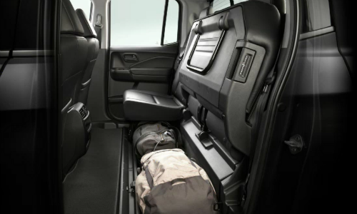 Rear seat up with luggage below it in 2020 Honda Ridgeline