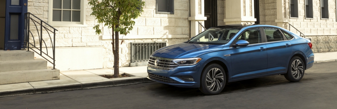 2019 Volkswagen Jetta in front of apartment building