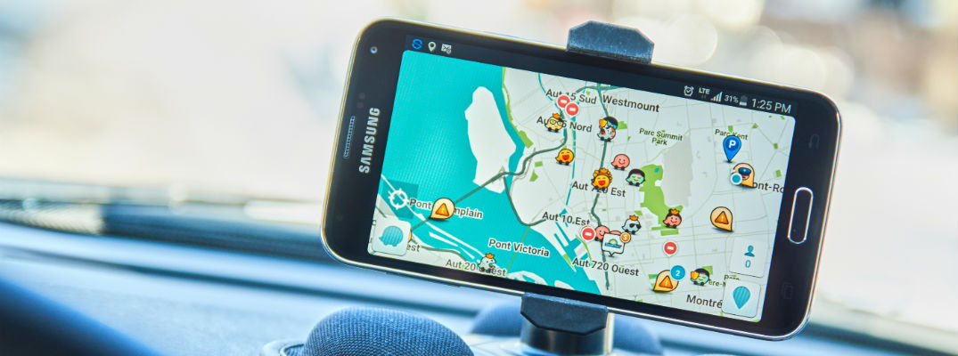 A stock photo of a person using a smartphone app for navigation.
