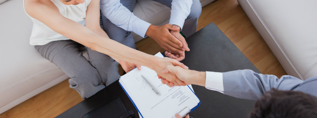 Man and woman shaking hands