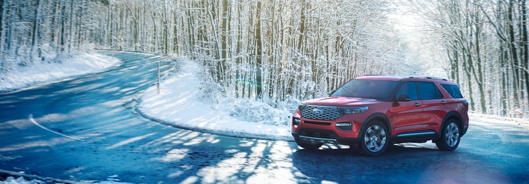 2020 Ford Explorer driving down a snowy road in the woods