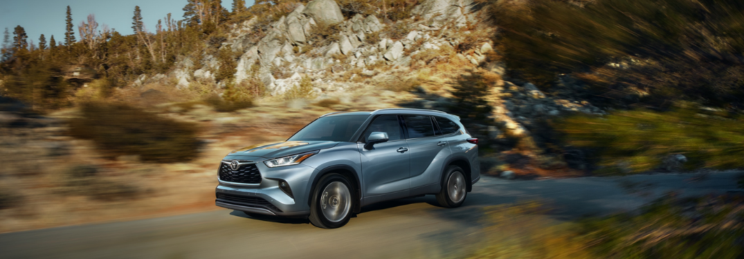 2020 Toyota Highlander driving down a rural road