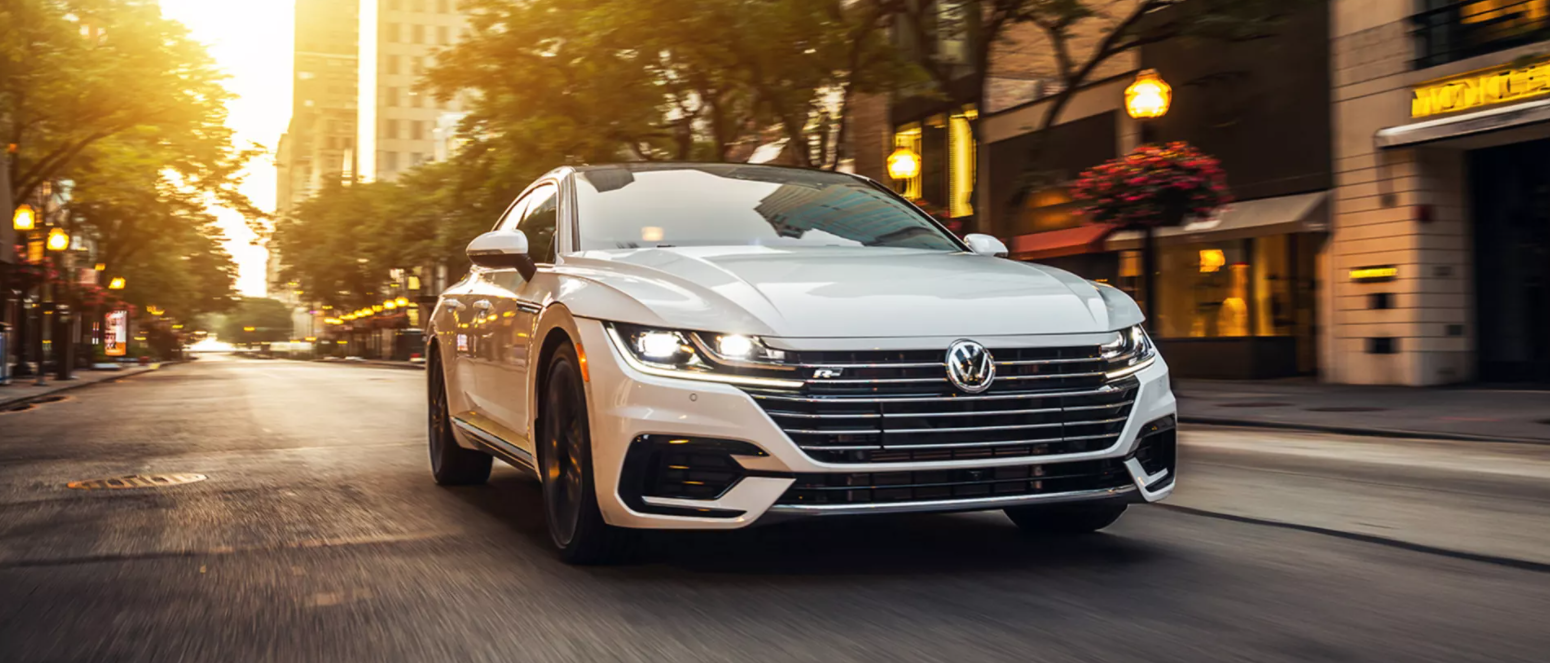 2021 Volkswagen Arteon driving down a city street