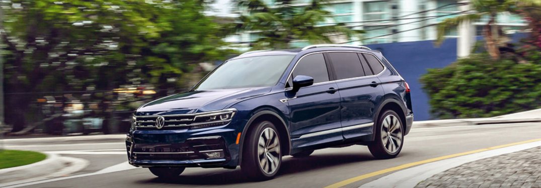 2021 Volkswagen Tiguan driving down a city street