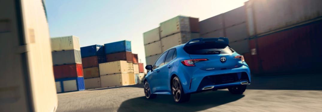 2021 Toyota Corolla Hatchback parked near shipping containers